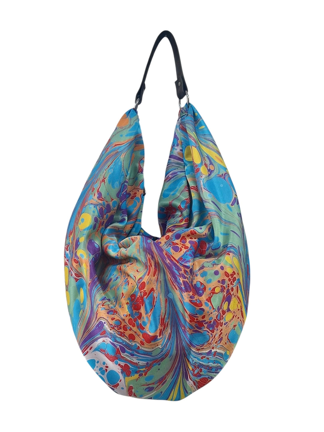 Colorful patterned bag with a black strap on a white background
