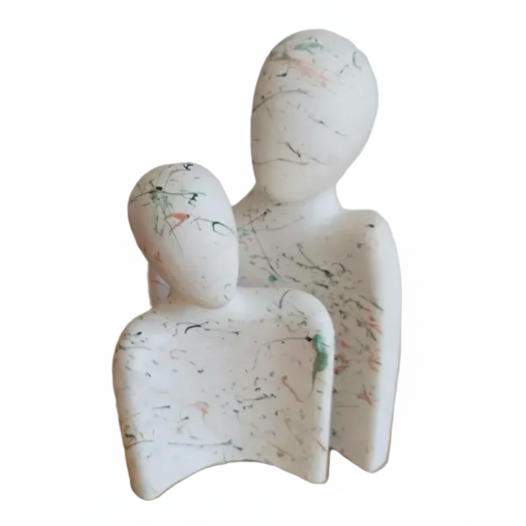 Abstract sculpture of two figures on a white background