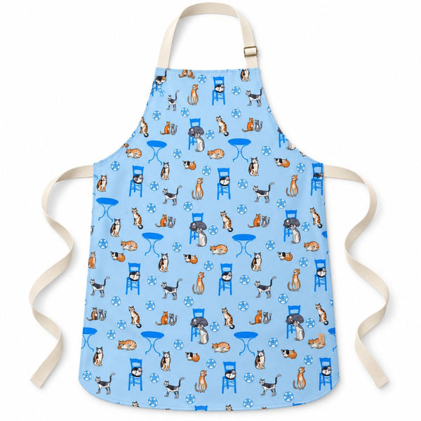 Greek Island Cats Apron – water-resistant apron with Greek cats, blue chairs and café tables on soft blue, front view | Thalassea