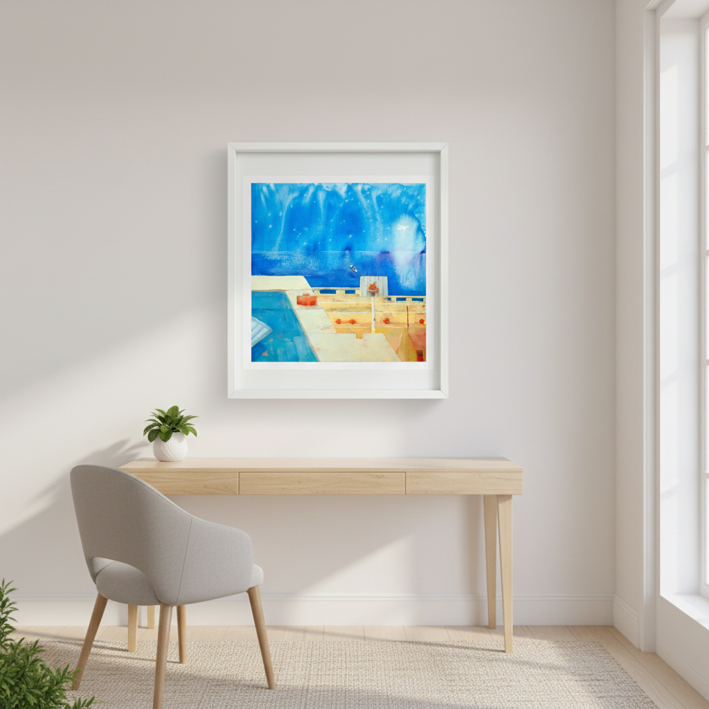 Framed artwork above a wooden desk in a bright room