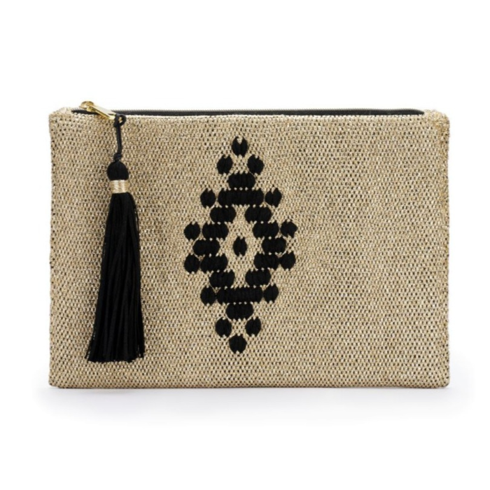 A handwoven beige clutch with a geometric black pattern and a tassel detail.