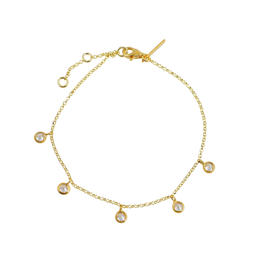 Gold bracelet with diamond-like beads on a white background