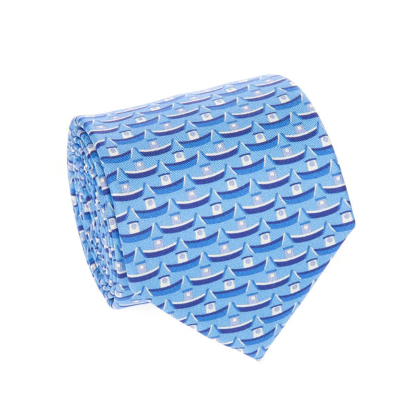 A rolled-up necktie featuring a repeating pattern of small blue boats with white sails on a light blue background.