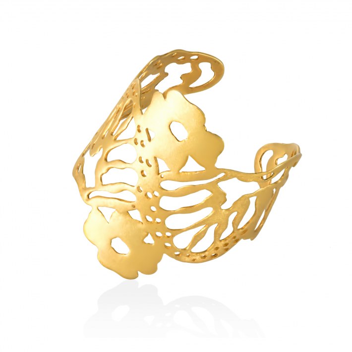 A gold-plated bracelet featuring a butterfly design, with intricate cut-outs and a textured surface, showcasing the craftsmanship.