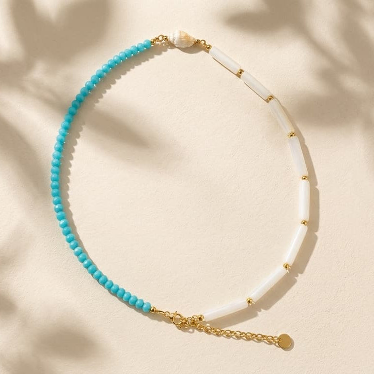 Thalassa Necklace – turquoise-blue and white shell beaded necklace in gold, flat lay alternate view | Thalassea