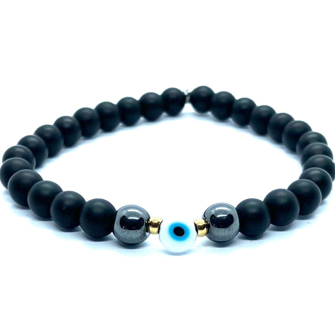 Black beaded bracelet with a blue evil eye bead on a white background